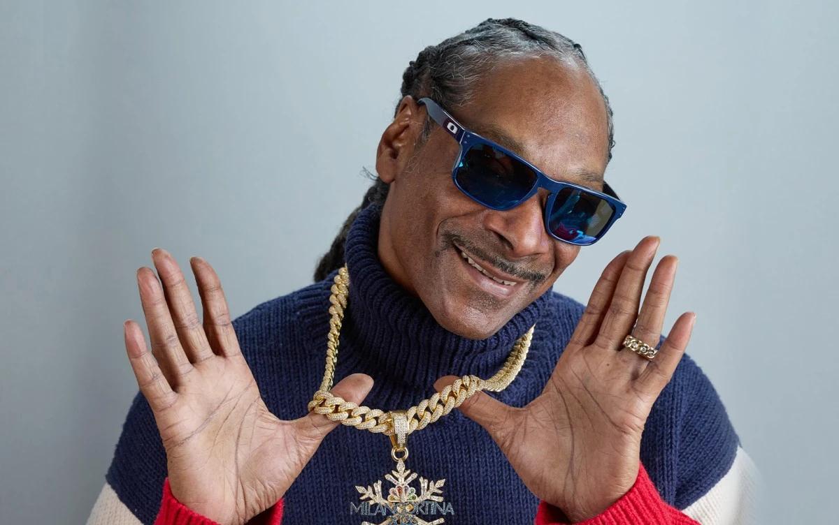 سنوب دوغ يتألق في الأولمبياد الشتوية 2026: أيقونة راب حاملة للشعلة ومدرب فخري